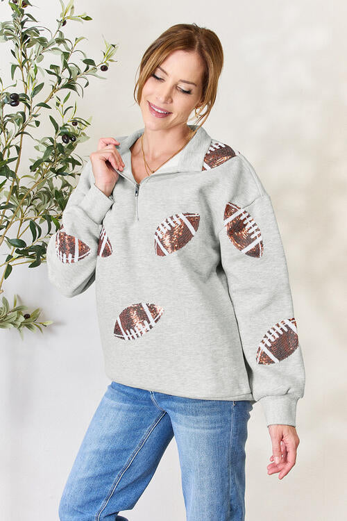 Double Take Full Size Sequin Football Half Zip Long Sleeve Sweatshirt - Premium Jacket from Trendsi - Just $42! Shop now at noTORIous + co